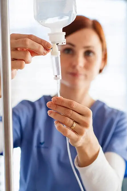 nurse checking the intravenous bag